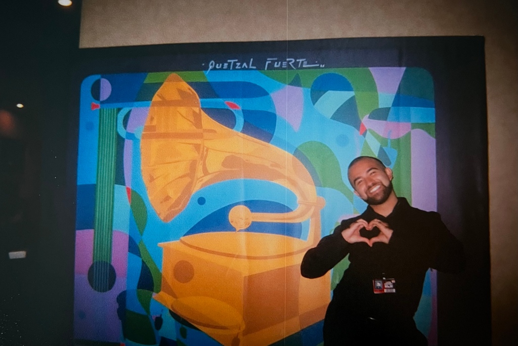Picture of Emanuel in front of the GRAMMYs artwork